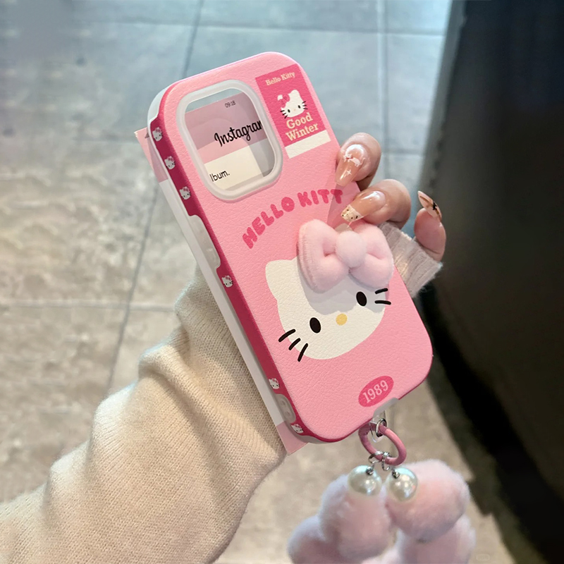 粉色哈喽kt猫立体蝴蝶结挂绳手机壳适用苹果16新年iPhone17promax皮纹秋冬hellokitty凯蒂猫14女15冷淡风可爱
