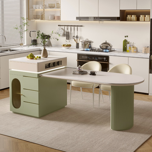 抹茶绿岩板岛台餐桌一体奶油风