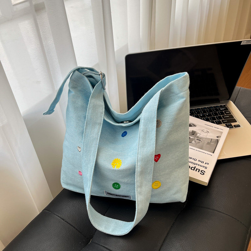 大容量斜挎牛仔帆布包女2025新款时尚刺绣托特包轻便购物通勤包