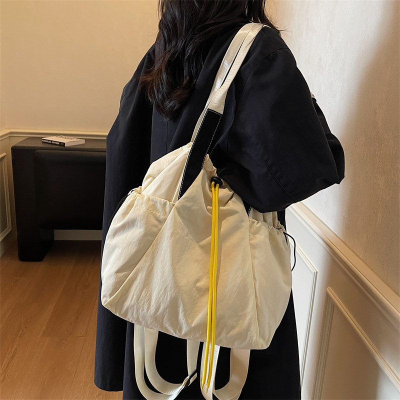 旅行双肩包包女式2025新款简约百搭帆布包轻便背包包大容量三用包