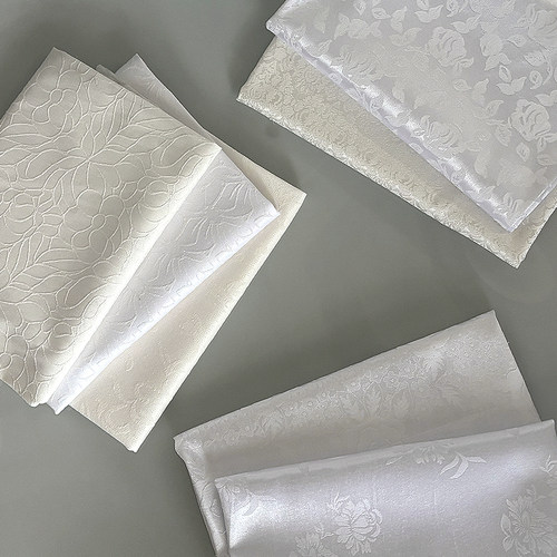 白色暗纹提花缎服装布料面料批发
