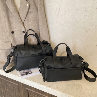 大容量防水帆布包女手提单肩斜挎包休闲通勤健身包黑色短途旅行包