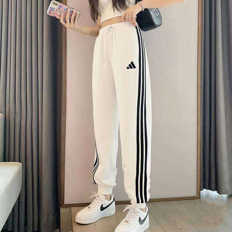Adidas阿迪达斯运动裤女裤秋季新款休闲裤针织宽松三条纹小脚长裤