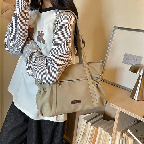 大容量休闲防泼水牛津布轻便单肩托特包女2026新款学生通勤手提包