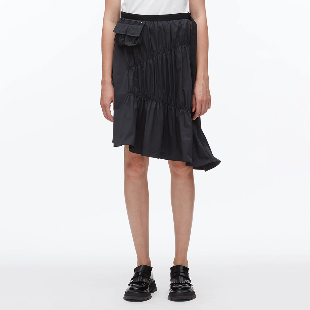 2025秋冬新款小众黑色松紧腰侧边口袋半身裙不规则裙摆中长裙女