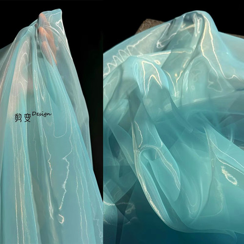 晴天蓝欧根纱液态透明服装布料