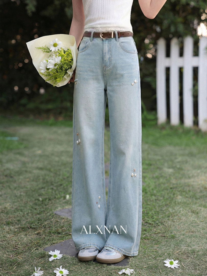 Light wash wide-leg jeans worn by a model outdoors