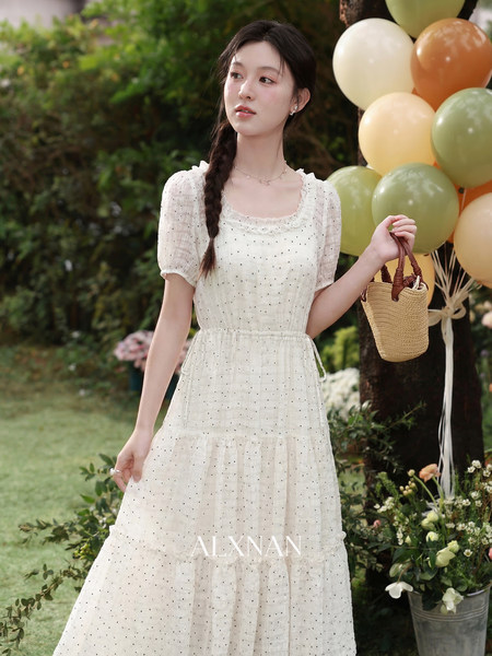 Model wearing a white puff-sleeve maxi dress outdoors