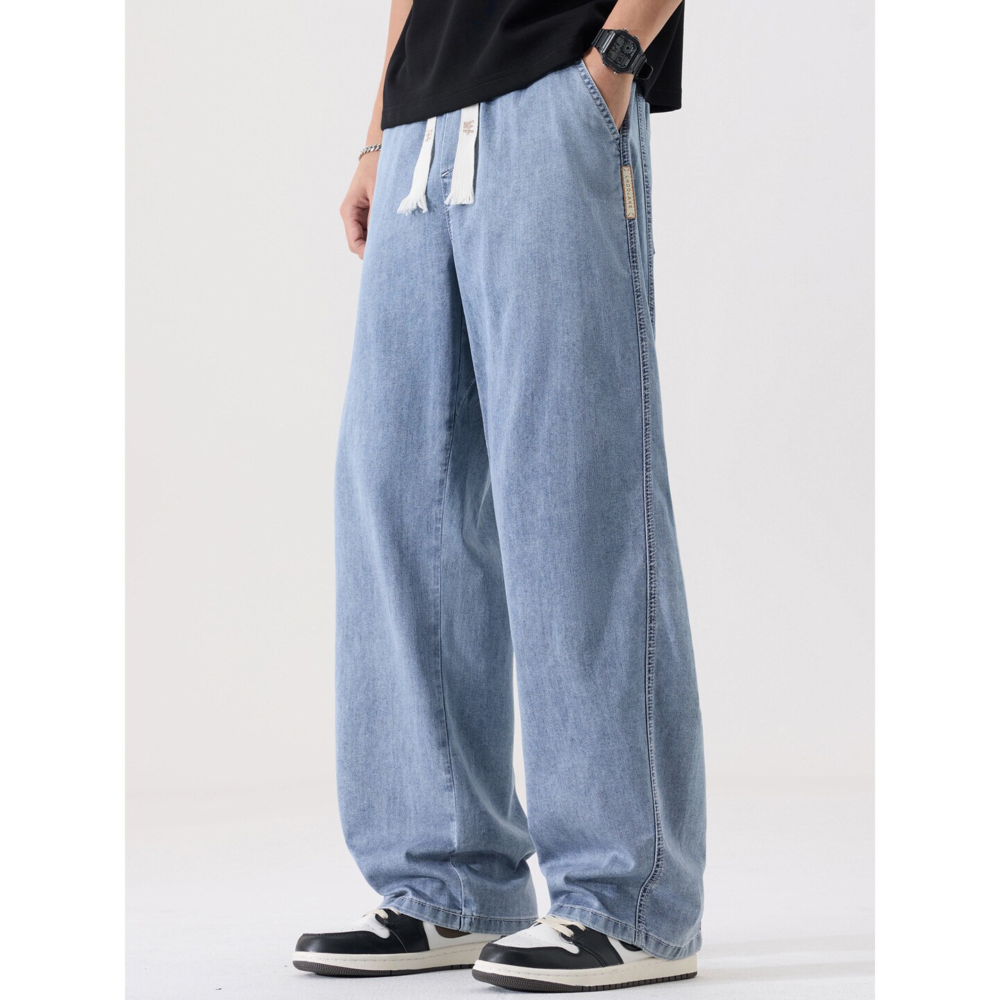 进口秋季薄天丝男款弯刀松紧牛仔裤大码宽松直筒弹力胖子加肥加大