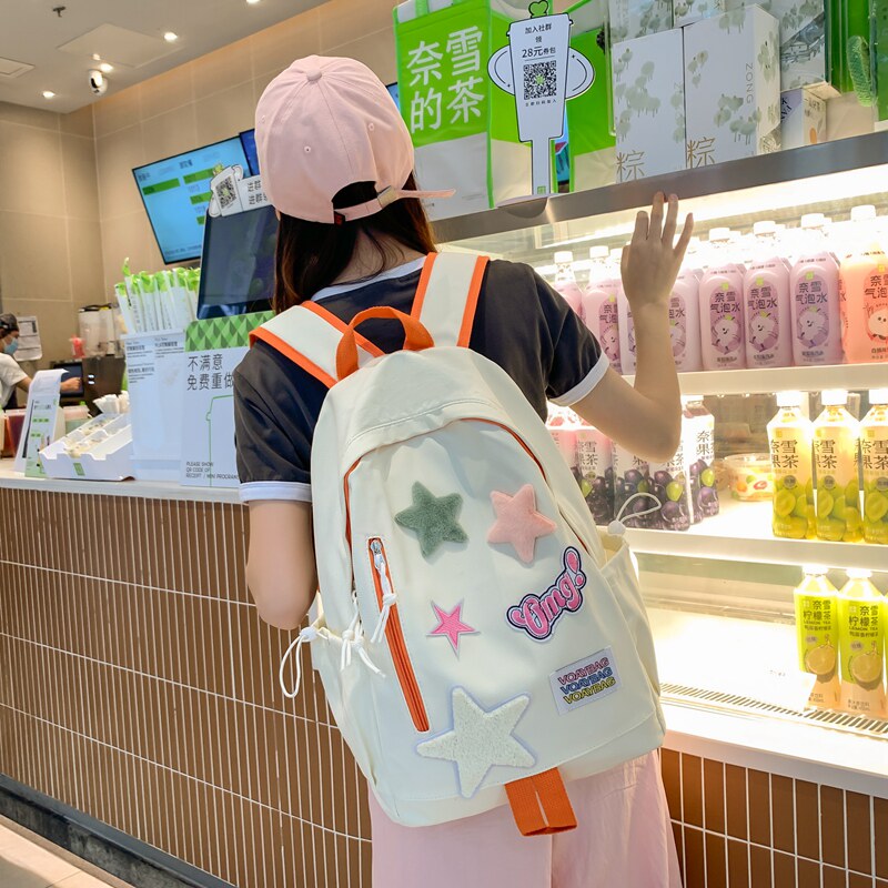 红鹮鸟小星星初高中减负护脊书包女生大学生大容量轻便双肩包男