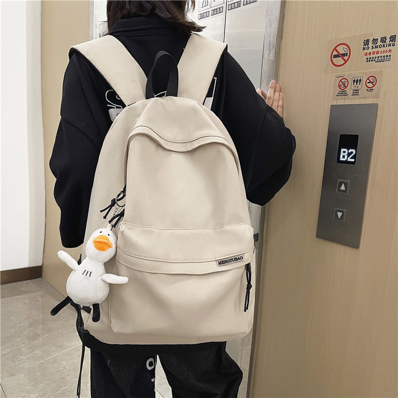 咖啡鼠男士简约大容量双肩背包
