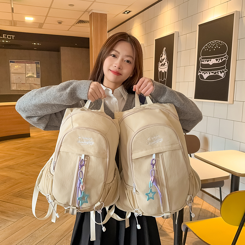 儿童书包女生小学生2025新款初中生高中生背包拼接轻便旅行双肩包