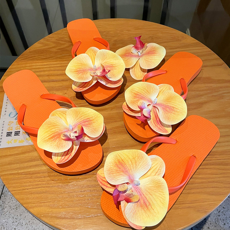 新款小众橘色蝴蝶兰人字拖可爱百搭花朵平底夹脚度假海边沙滩拖鞋