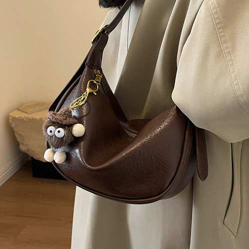 时尚单肩简约斜跨小众通勤饺子包