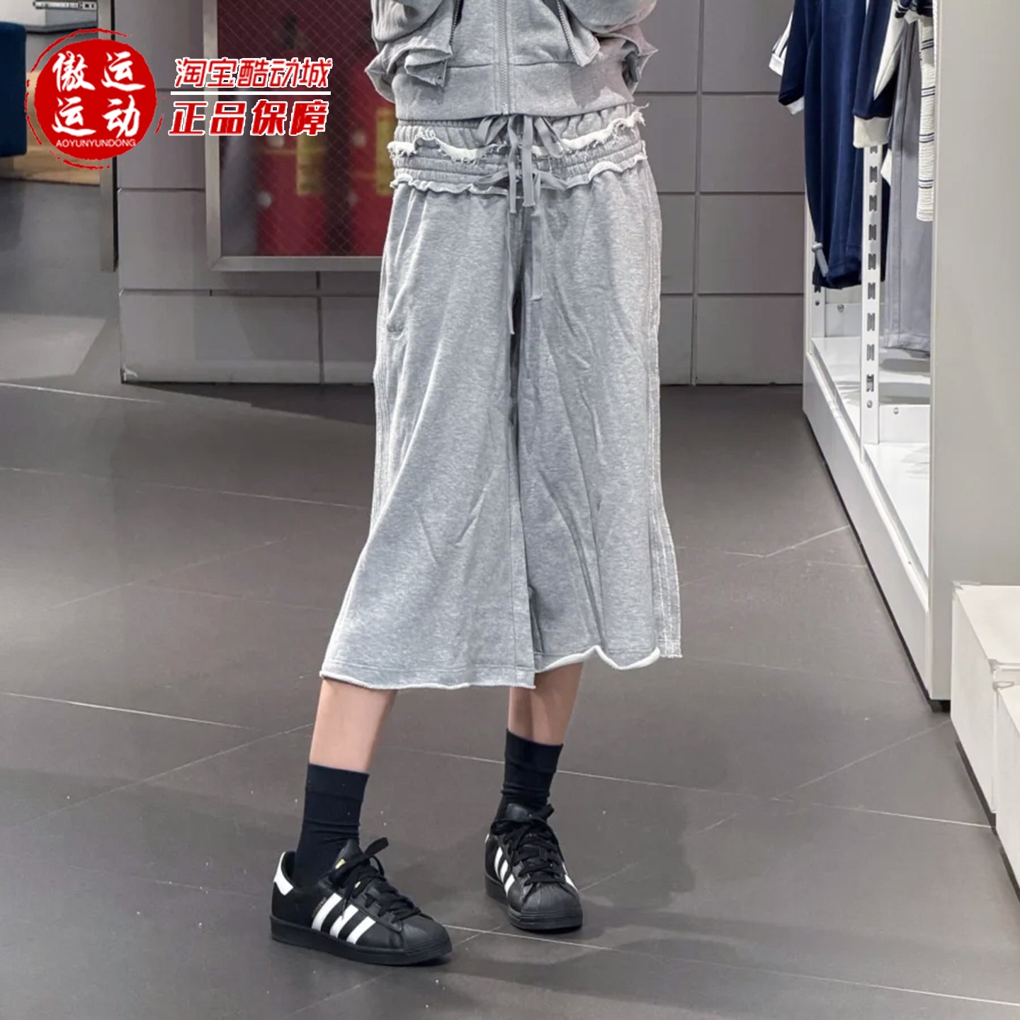 阿迪达斯女子宽松双层绑带短裤