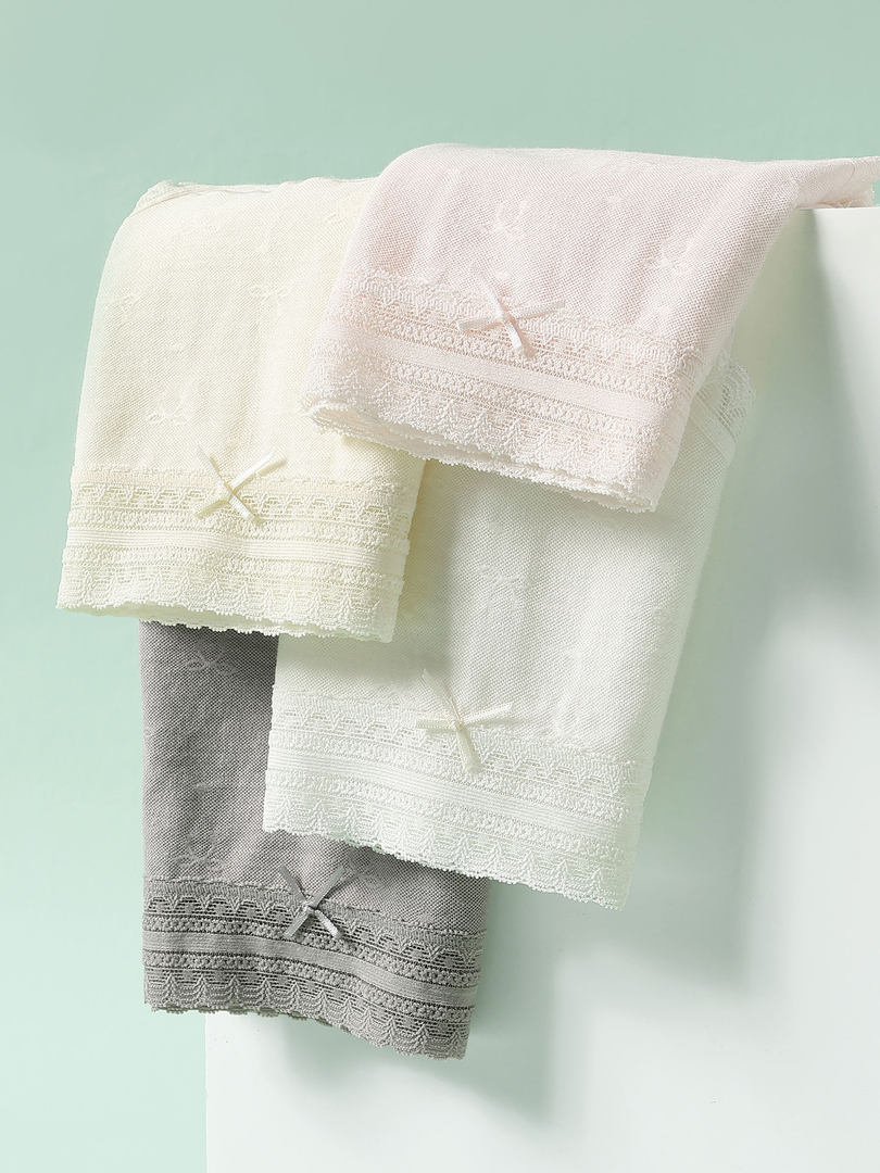Embroidered towels hanging on a rod