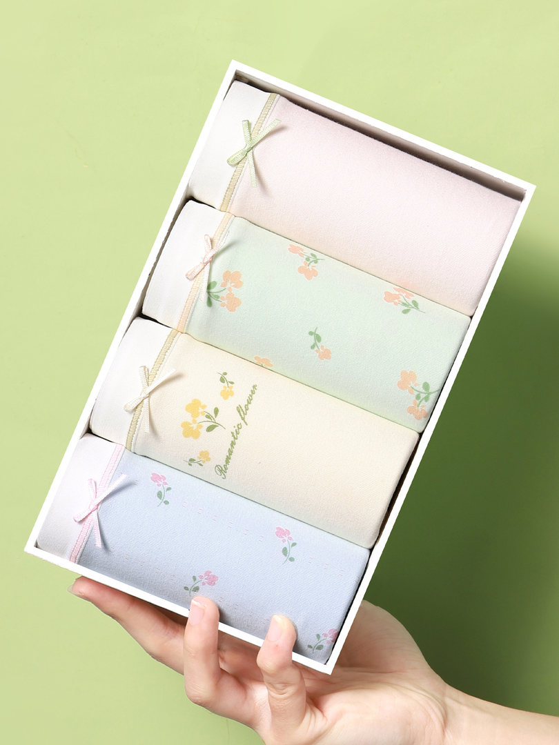 Box of pastel floral underwear briefs displayed in packaging