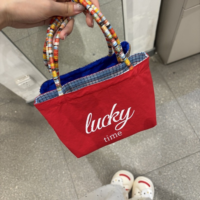 可爱便携防泼水小手提百搭休闲手机包收纳包通勤包包