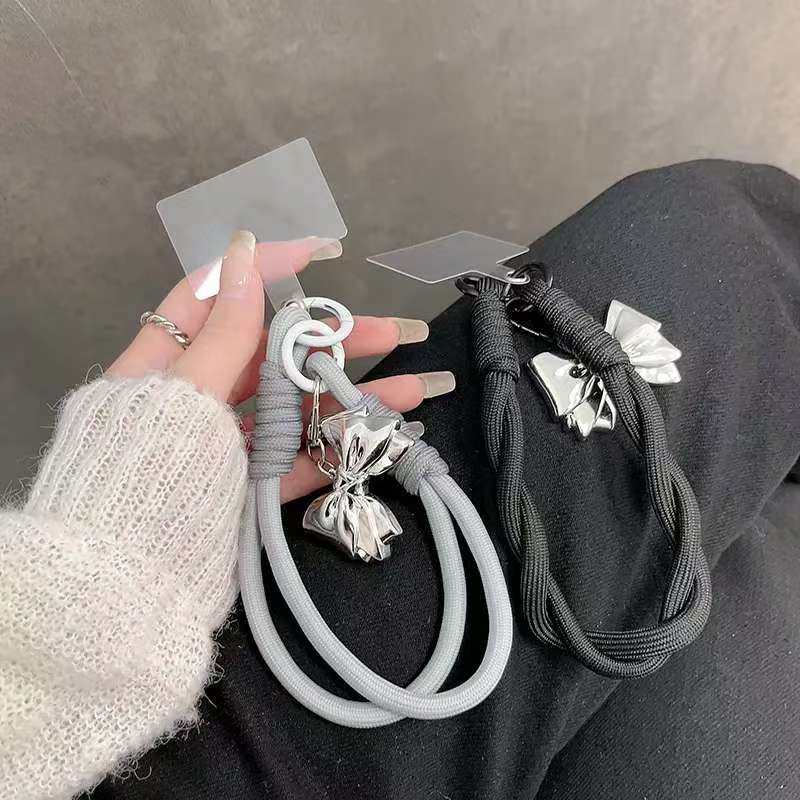 日韩ins银色蝴蝶结银扣手机壳挂链黑色编织带手腕带挂绳钥匙挂链图片