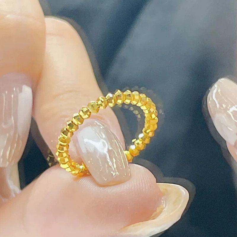 18k金戒指女碎金子蹦迪珠弹力记忆爆闪黄金色绕圈时尚高级感指环