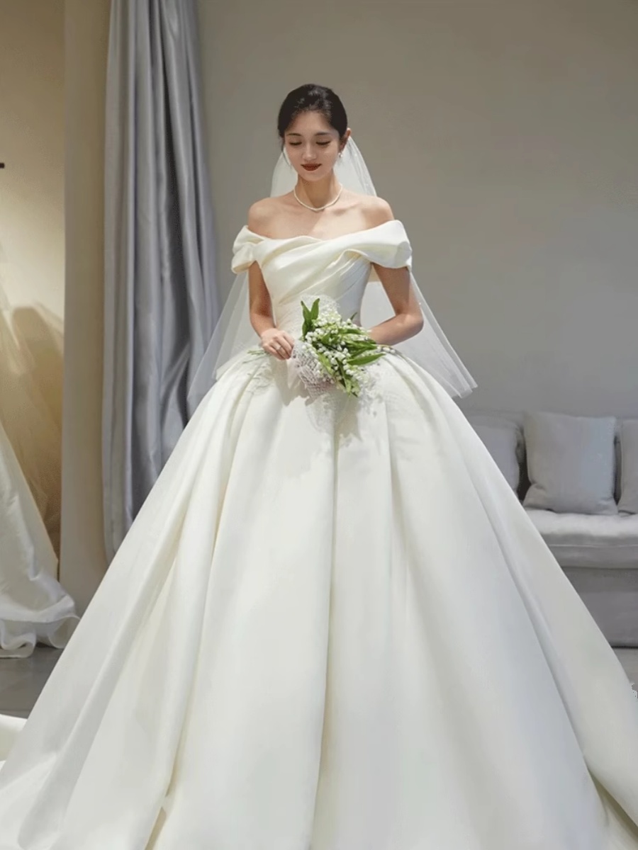 One word shoulder bride satin main wedding dress 2024 new pregnant woman simple and high -level texture long drag out of the gauze One word shoulder bride satin main wedding dress 2024 new pregnant woman simple and high -level texture long drag out of the gauze
