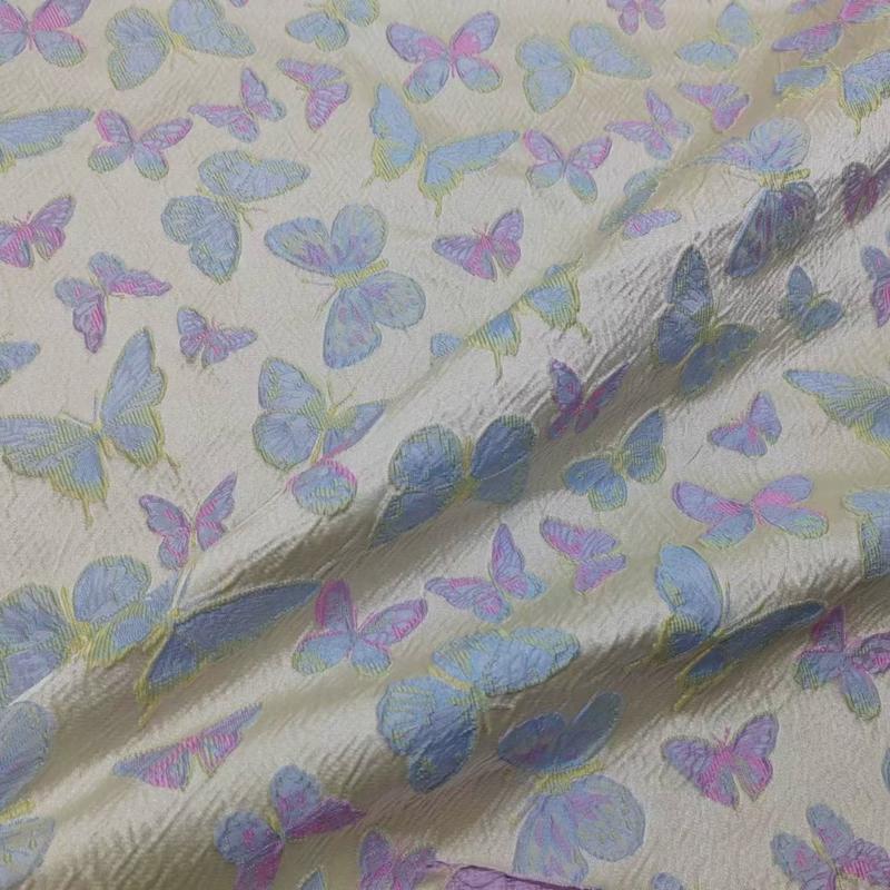 提花粉蝴蝶撞色立体浮雕括布蓝织锦布料蓬蓬裙时装箱包面料