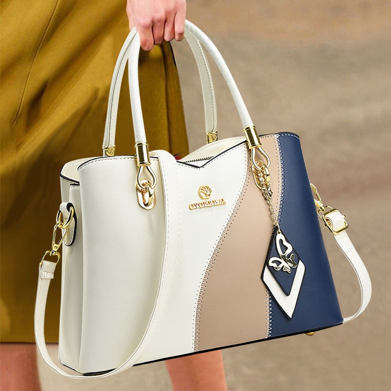 香港真皮女包2025新款撞色手提包女大容量托特包通勤包斜挎单肩包