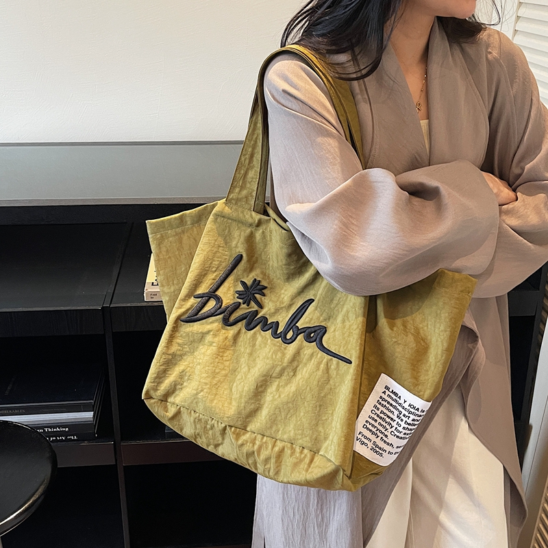 大容量帆布包包女式2025新款高端大气刺绣休闲购物袋妈妈款通勤包