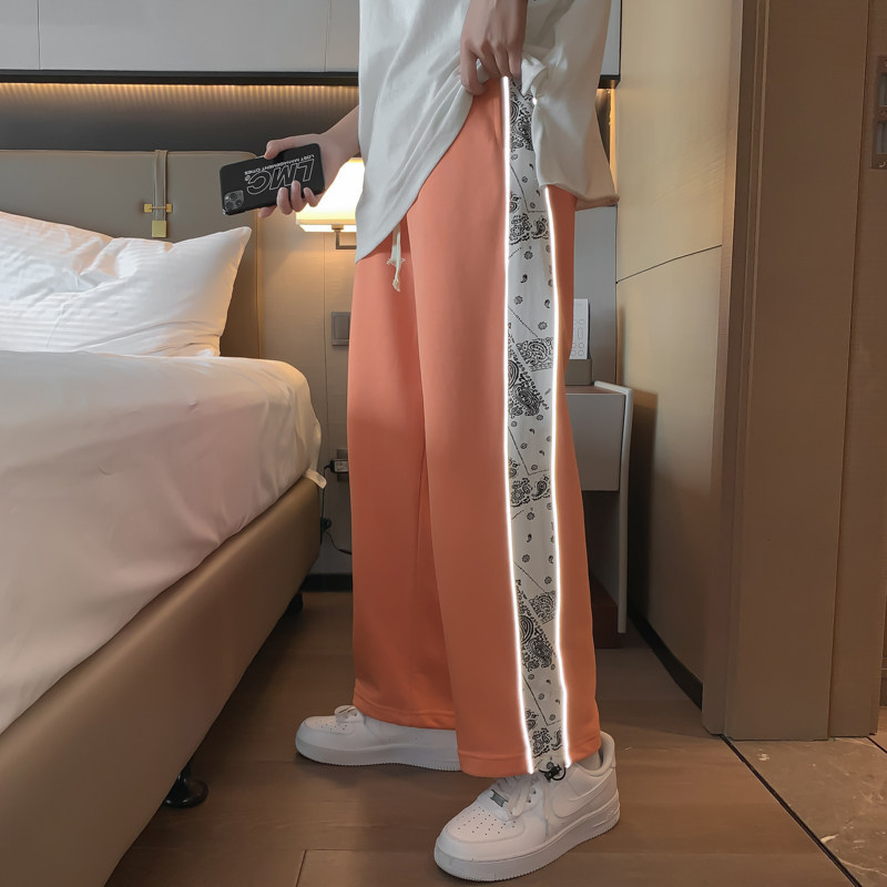 新款男女中性休闲裤反光条纹直筒透气哈伦卫裤运动裤九分裤图片