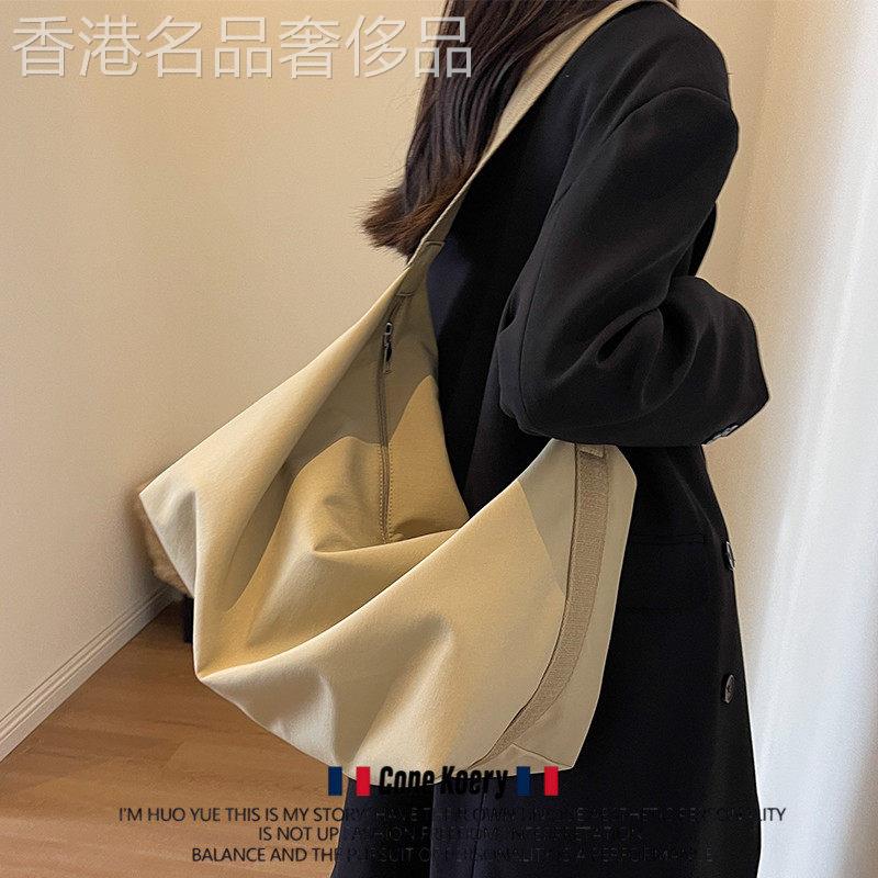 法国大容量帆布斜挎包女2026新款托特饺子包包通勤布包单肩背包男