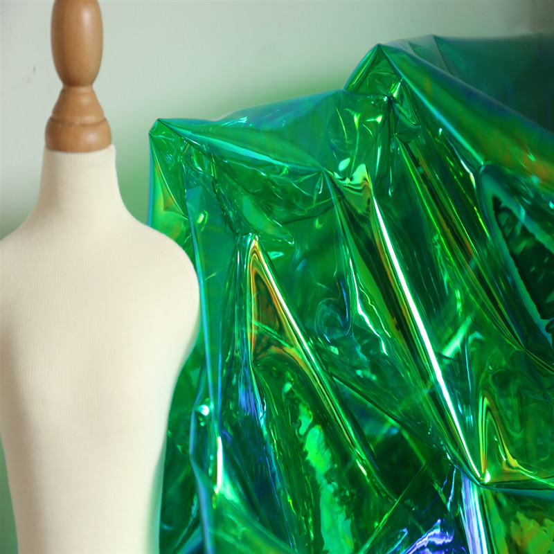绿色幻彩pvc布料镭射反光科技元素透明塑料镭射包防水t台服装面料