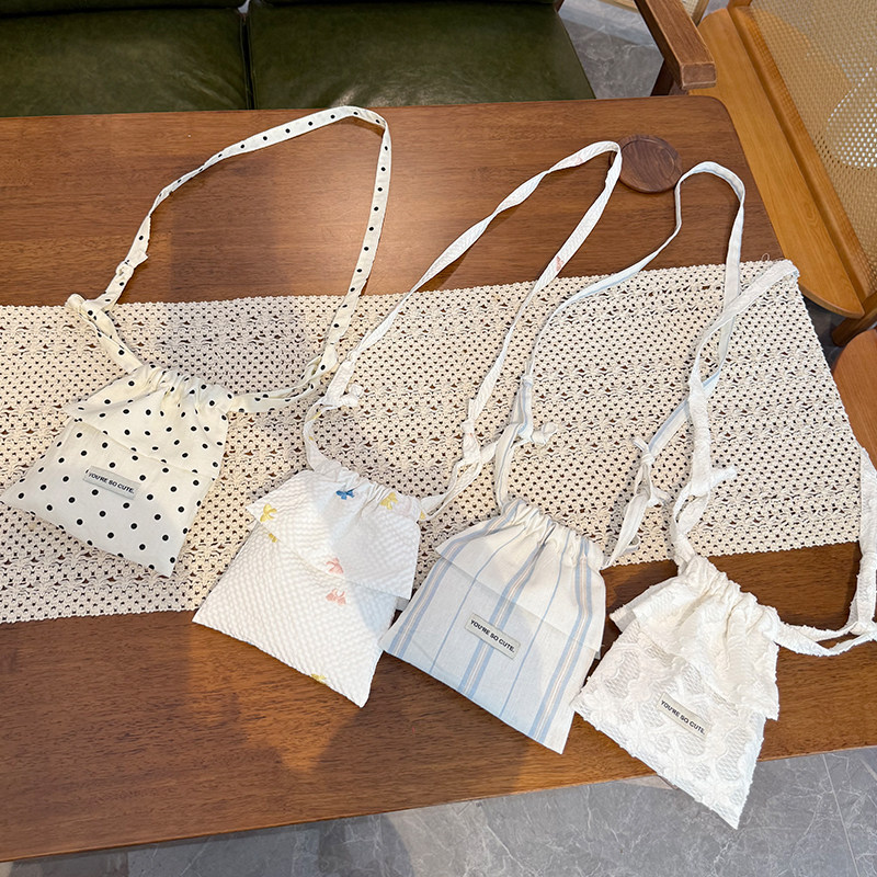 夏季蝴蝶结波点花边木耳斜挎抽绳两用包时尚百搭遛弯包包,箱包皮具/热销女包/男包,时尚帆布包,淘宝优惠券,粉丝福利购,淘宝优惠卷