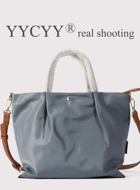 2025新通勤托特包女大容量手提斜挎包休闲简约风饺子包压褶单肩包