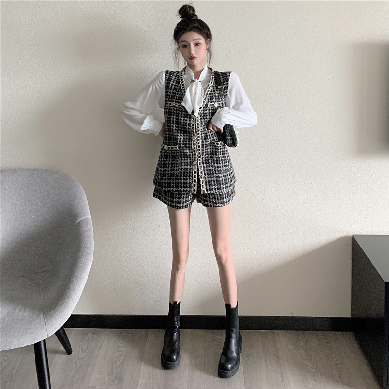 Three piece women's suit with collar shirt, plaid tweed vest and wide leg shorts