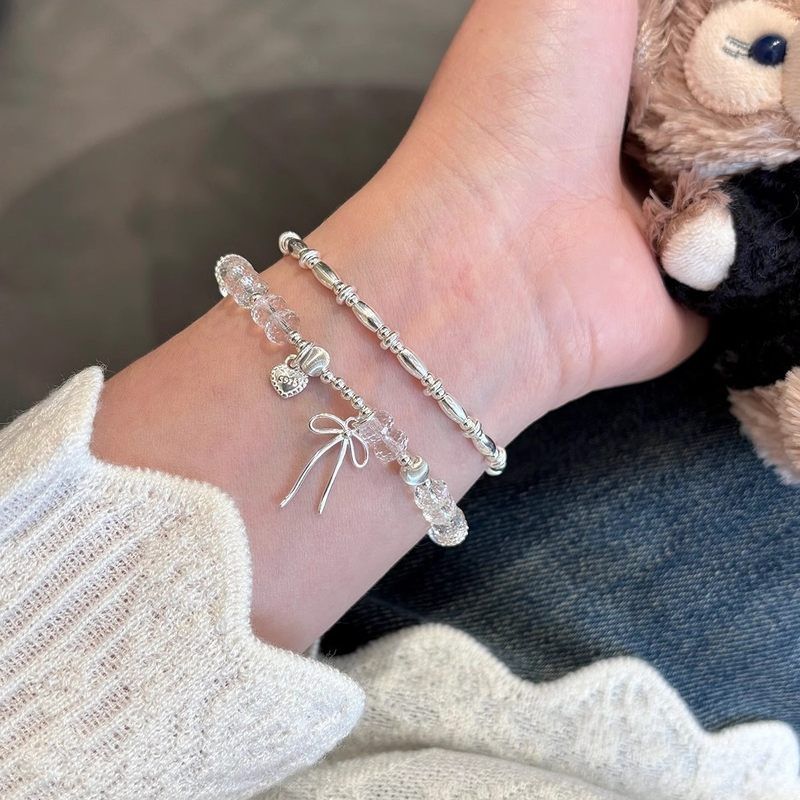 s925纯银刻面白水晶蝴蝶结手链女小众设计轻奢高级感爱心吊坠手饰