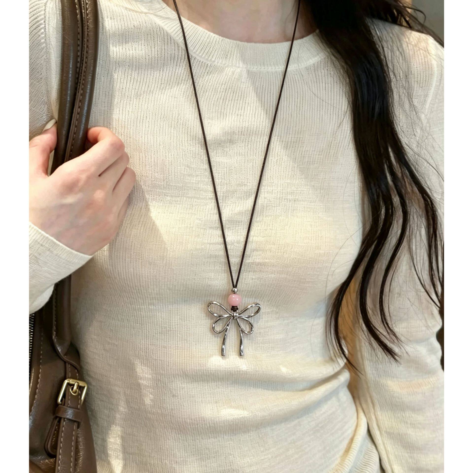 韩系ins风镂空蝴蝶结抽拉式长款皮绳项链女甜美温柔风串珠毛衣链