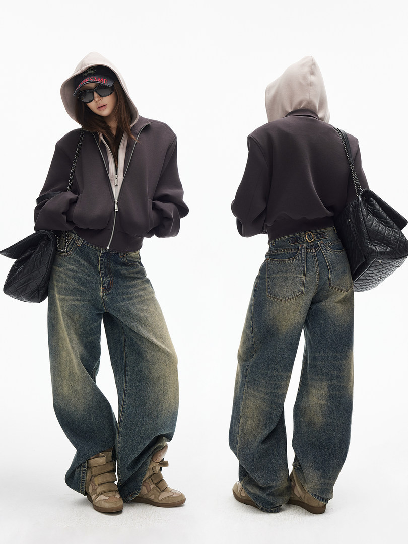 Model wearing a dark hooded zip jacket with wide-leg jeans and sneakers, shown front and back
