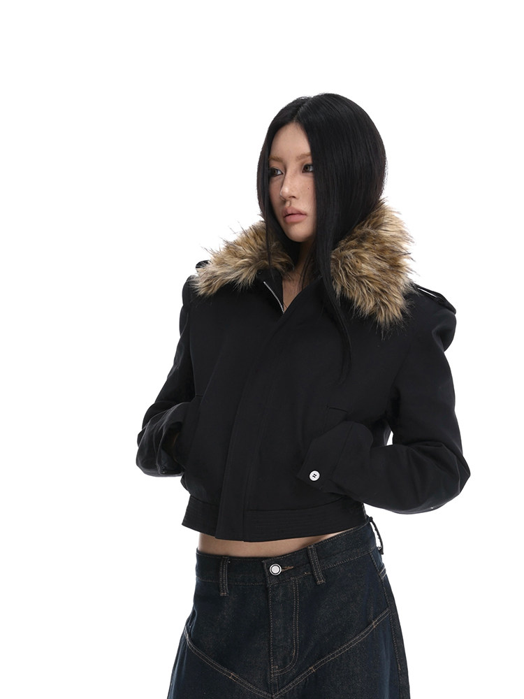 Black cropped jacket with fur collar worn by a model