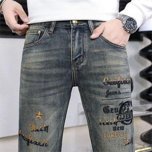 高端刺绣牛仔裤男修身小脚弹力休闲男款高级痞帅潮流炸街复古做旧