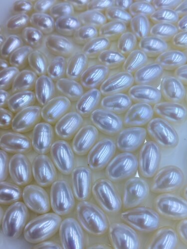 水之泪天然淡水无核珍珠散行业8-9mm长米形裸珠半孔强光微微瑕diy
