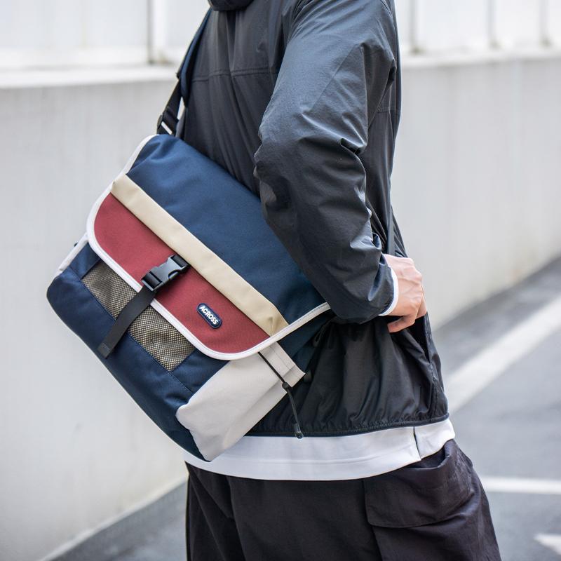 across大容量斜挎包男士电脑包背包运动单肩挎包女通勤骑行邮差包