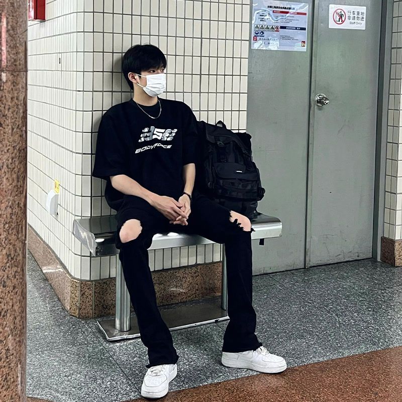1506/Q80510/P32纯黑色破洞牛仔裤男高街潮牌修身直筒微喇裤图片