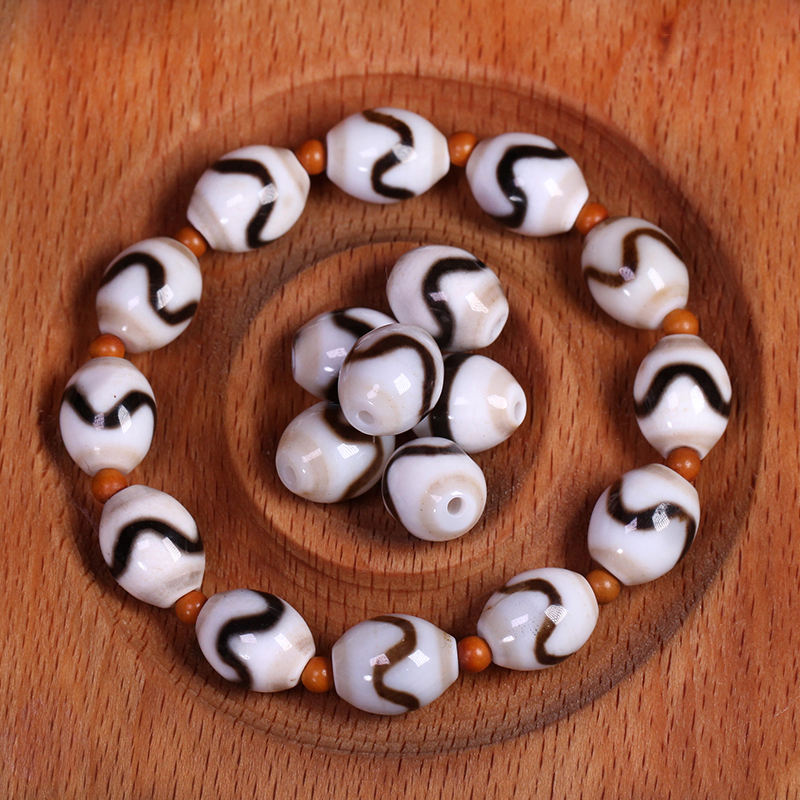 圣饰奇缘 西藏天然玛瑙黑白虎牙天珠手串配珠配饰10*13mm左右