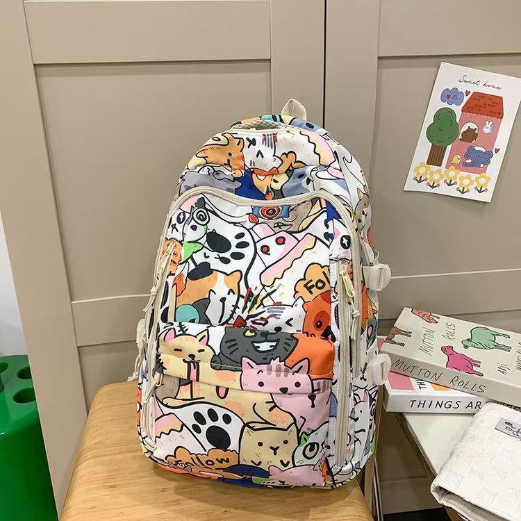 新款大容量彩绘书包女小学生初中生高中生卡通可爱涂鸦双肩背包男