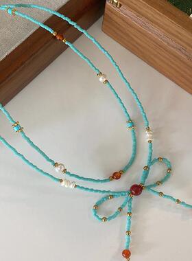 蓝色天然石项链女款2024新款蝴蝶结锁骨链轻奢高级感串珠玛瑙颈链