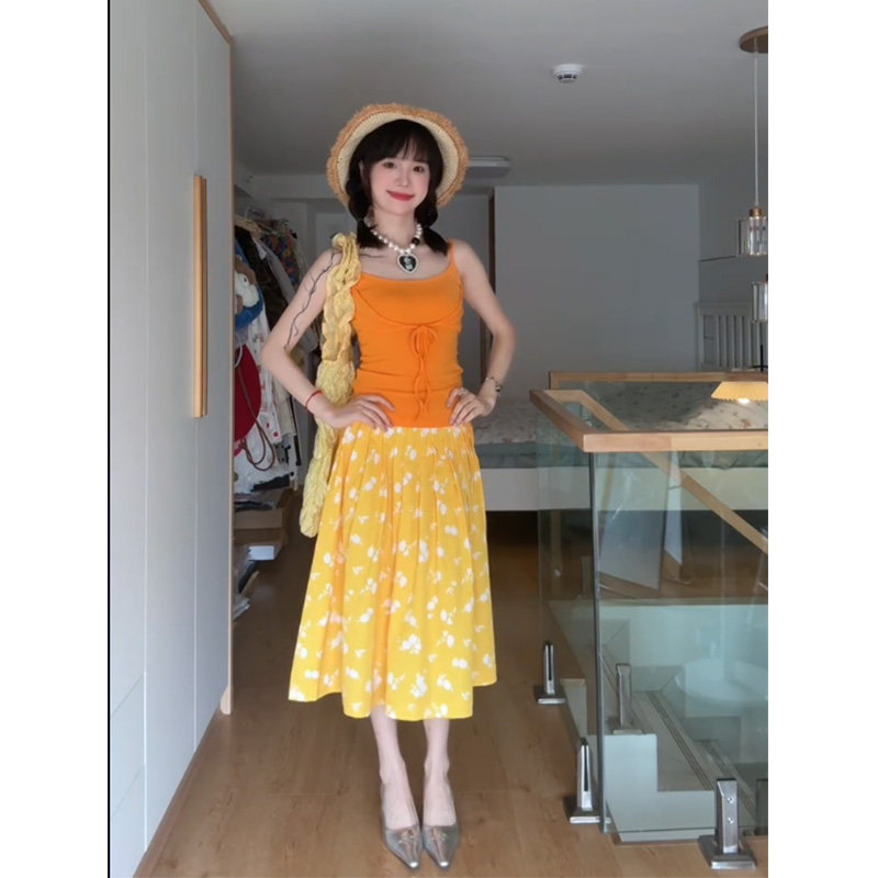 度假风花卉印花半身裙女2025新款休闲百搭宽松显瘦压褶黄色A字裙