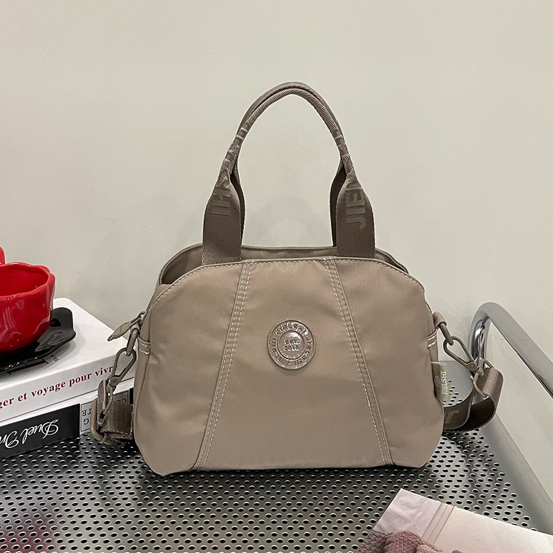 手提斜挎包包女2025新款秋冬百搭妈妈包牛津布大容量通勤女单肩包