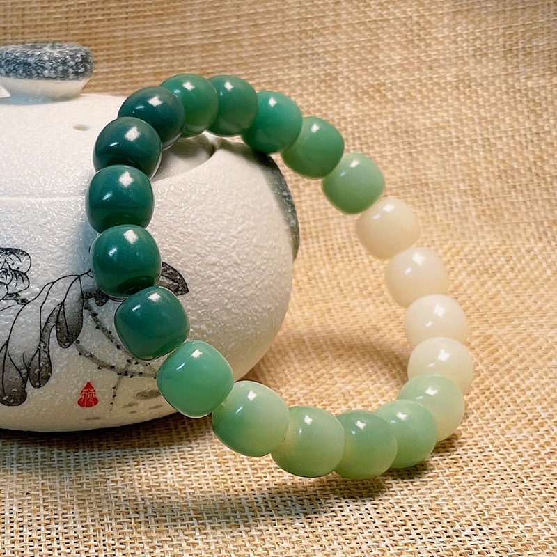 白玉菩提天然渐变桶珠绕指柔手串