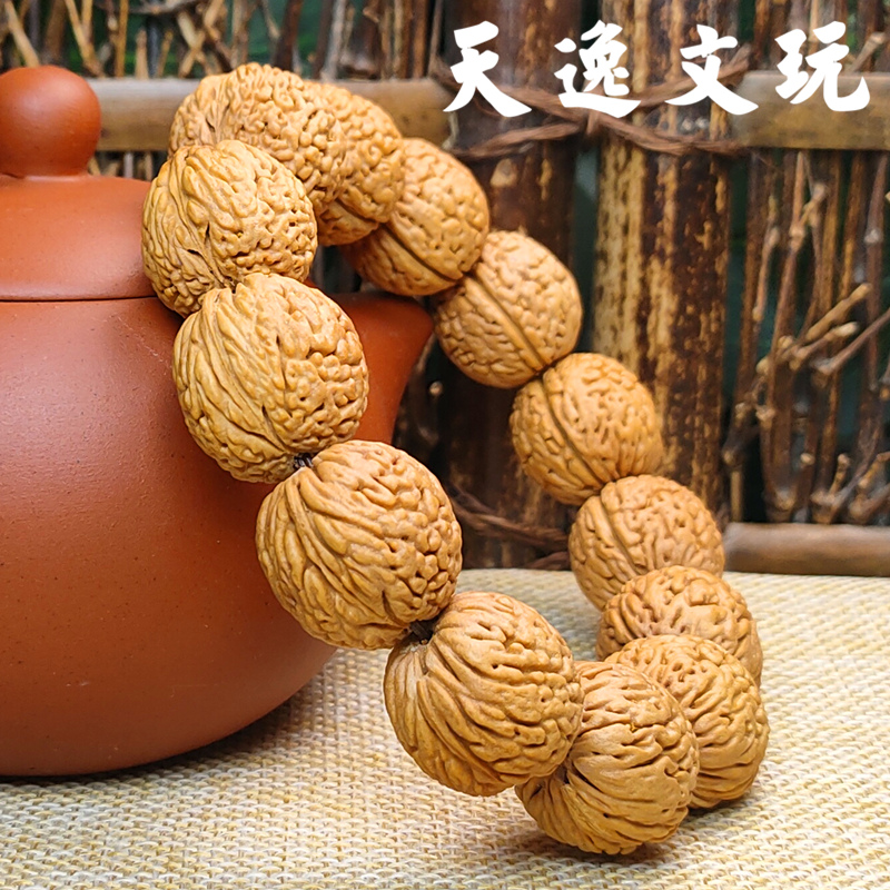 凤尾脐蚂蚁纹桃核正圆手把件佛珠