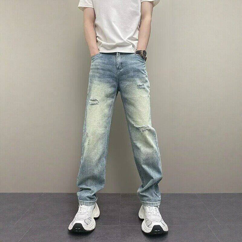 水洗磨白蓝色破洞牛仔裤男士